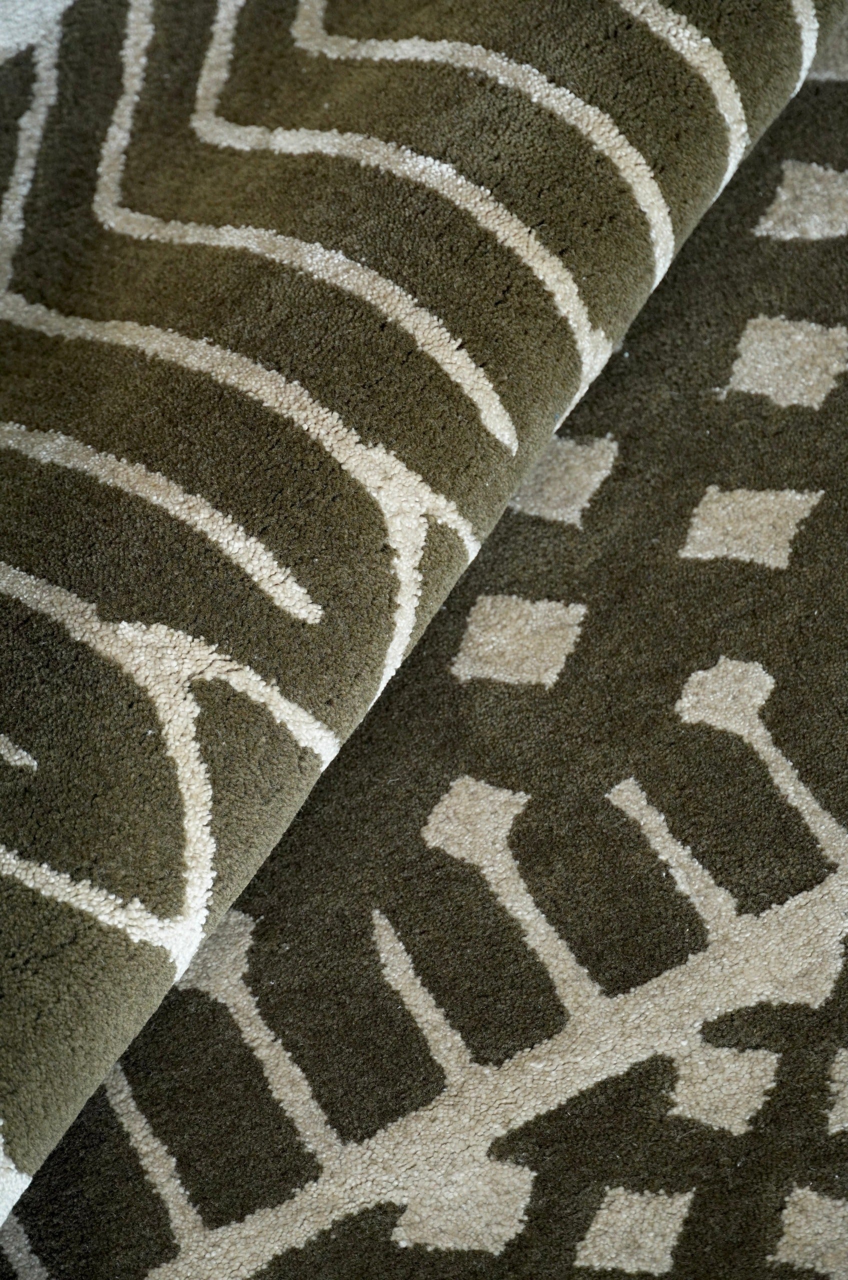 The rich-looking Paradox rug transforms your space into a high drama realm that is at once light-hearted and profound. The pure, natural New Zealand wool with an underlying gleam of Jasmine silk gives it a luxurious feel that keeps you rooted. The Paradox’s 3D cut-out and visually striking B&amp;W criss-cross pattern is both playful and flamboyant. It’s striking geometric design makes a style statement in any space, when draped on a wall or on the floor.